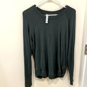 Green long sleeve Athleta top.
